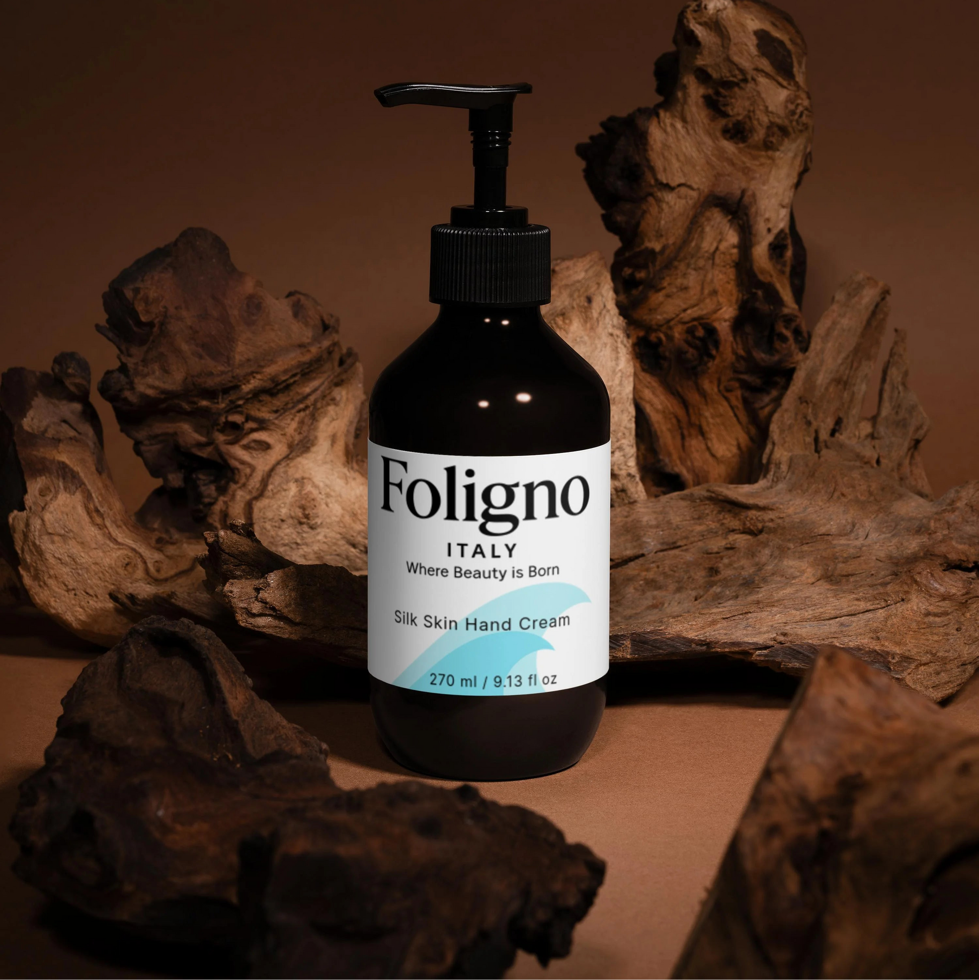 Foligno hand cream bottle with pump dispenser on a wooden background
