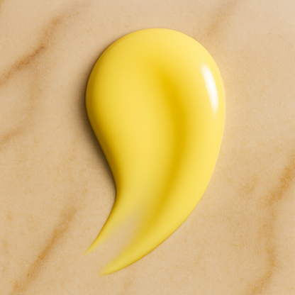 Yellow droplet on a beige marble background