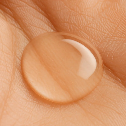 Close-up of a droplet of cream on skin