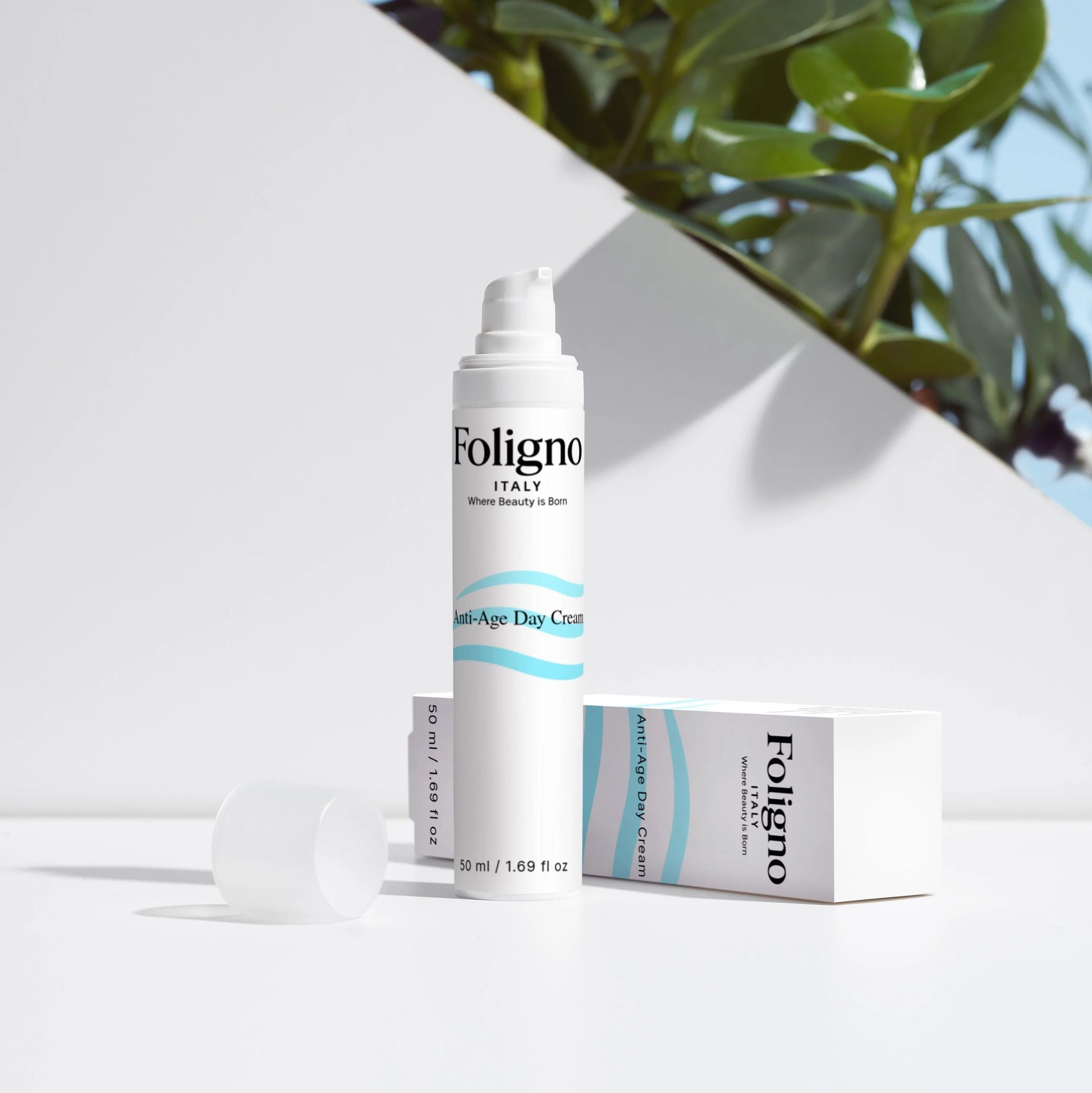 Foligno skincare product with packaging on a white surface with greenery in the background